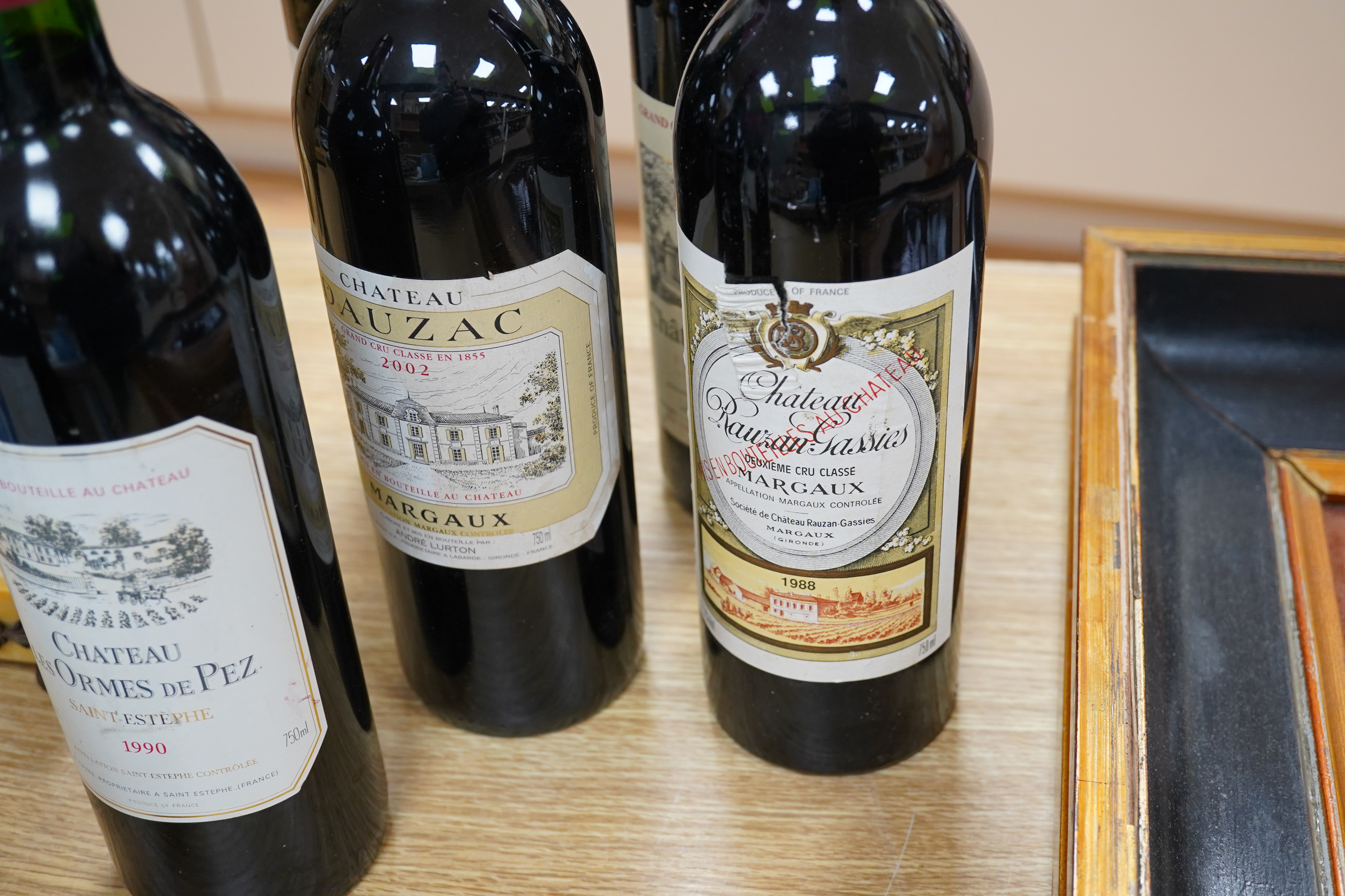 Six mixed bottles of French red wine: a bottle of 1992 grand cru classe de graves, Chateau Olivier, a bottle of 1993 grande classe Chateau Lafon- Rochet, Saint-Estephe, a bottle of 1988 grand cru classe, Dauzac, Margaux,